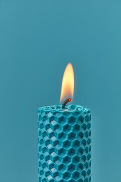 Close up of burning candle with cell pattern.