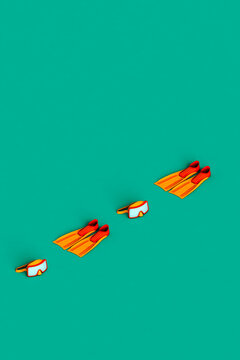 scuba masks and flippers in a row