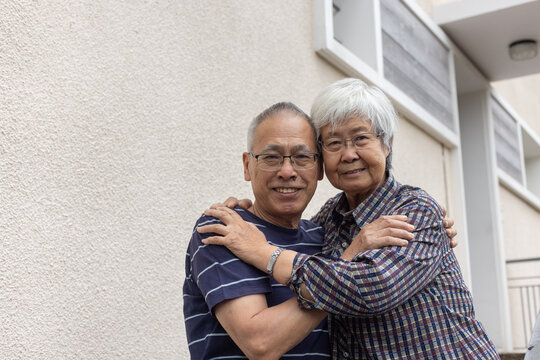Love, Portrait Of Senior Asian Couple Near Their Home Entrance Door