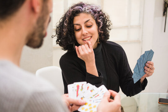 Woman cheating at cards