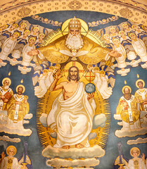 ZURICH, SWITZERLAND - JULY 1, 2022: The fresco of Holy Trinity among the saints in main apse of...