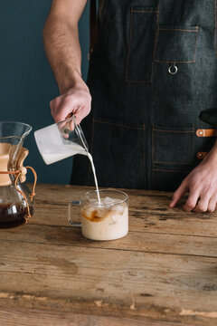 Barman Preparing Coffe With Milk