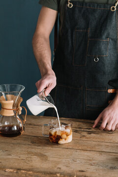 Barman Preparing Coffe With Milk