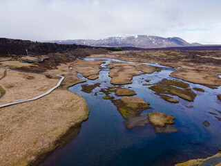 Aerial shot, Nice landscape of mountains and rivers with mossy field in iceland