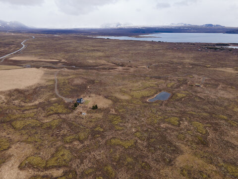 aerial photo taken with a drone of a landscape with a field of muzgo and sea in the background
