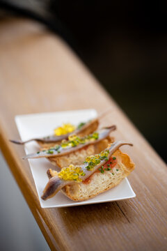Catering  presentation of a  toast with anchovy