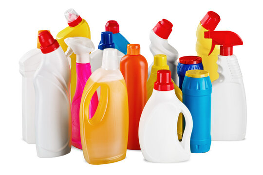 Plastic bottles and cleaning equipment on white background