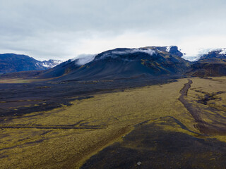 Aerial shot, Nice landscape of mountains and rivers with mossy field in iceland