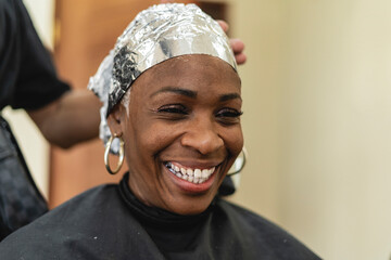 Cheerful woman at the hairdresser's. 