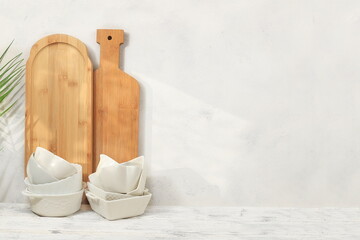 Fototapeta na wymiar Kitchen table with utensils and cutting boards.Simple home kitchen interior, mockup for product design and display, zero waste and healthy lifestyle concept