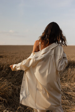 Woman getting dressed in shirt