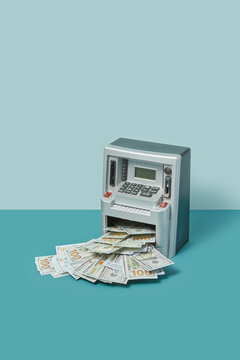 Withdrawing dollars from cash machine mock-up.