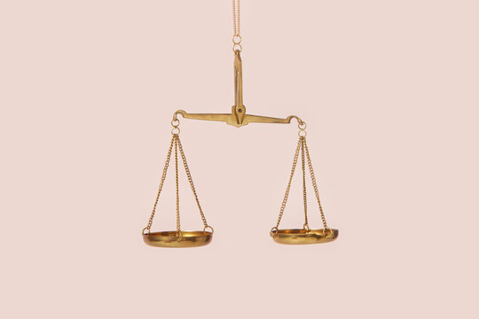 Empty golden vintage scales of justice.