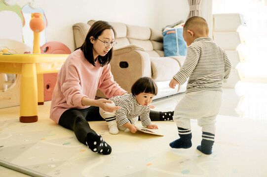 Asian Mother And Kids Playing At Home