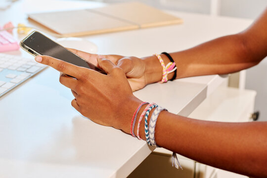 Businesswoman Cell Phone At Desk.