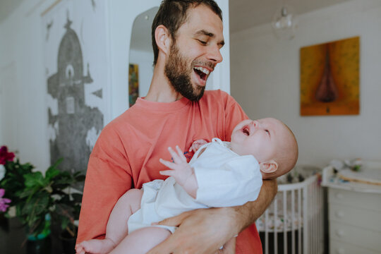 father holding little daughter