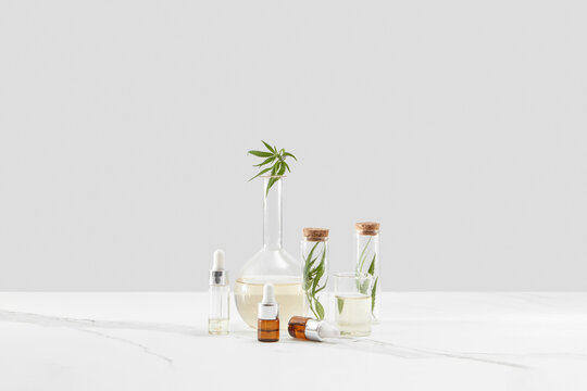 Natural oil bottles and glasses with cannabis.