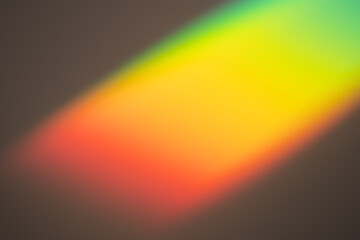 Rainbow light on dark background. Beautiful backdrop for design projects. Fantasy overlay wallpaper. Abstract multicolored photo. Creative backplate for cosmetics, beauty products. Freedom concept