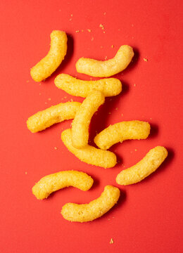 Cheese Puffs on a red background