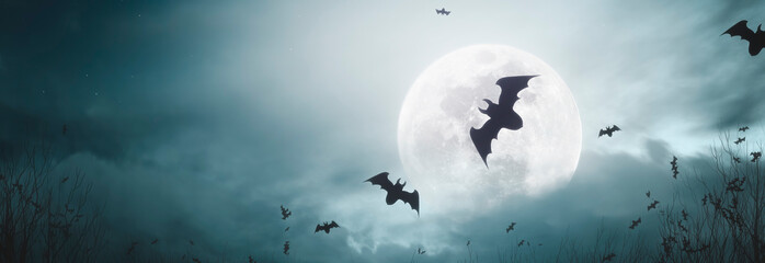 spooky background with bats flying under the moonlight at halloween night - copy space