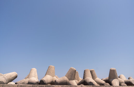 Breakwater Stones And Blue Sky