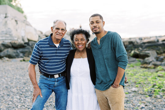 A Mother With Her Husband And Adult Son