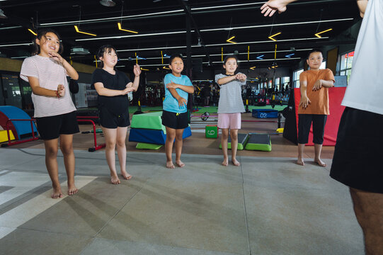 Happy kids training in gym