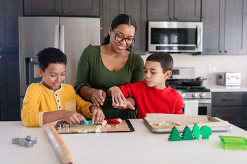 Mom with children making cookies together