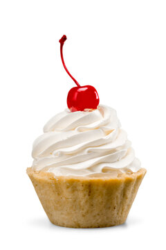 Cupcake,dessert with whipped cream and a cherry on top - isolated image