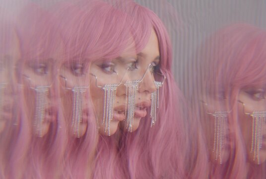 Multi exposure portrait of woman with pink hair
