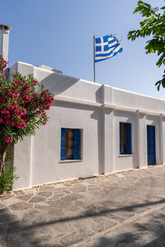 White Building With Greek Flag