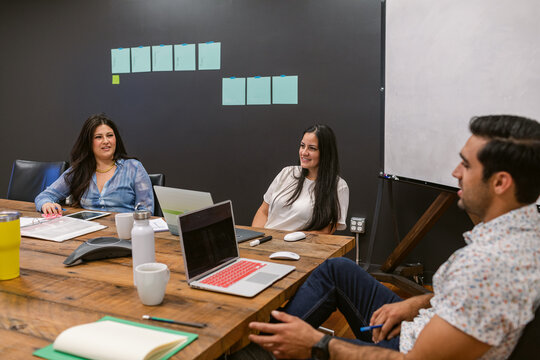 Multiracial business group meeting