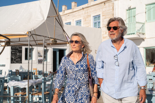 Senior Couple Walking On The Street