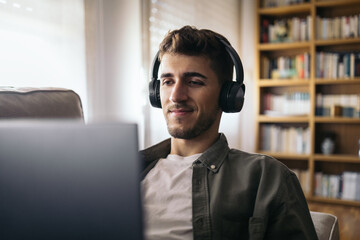 Young man on a video call working from home