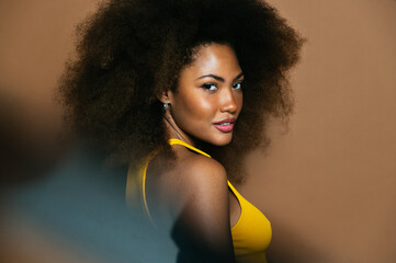 Stylish black woman with curly hair