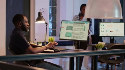 Company employee analyzing information on business app, working with web 3.0 website navigation on computer late at night. Using search text page to browse data research on www application.