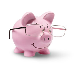 Piggy bank in glasses on background