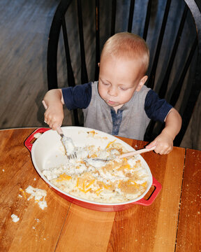 Kid Eating Mashed Potatoes