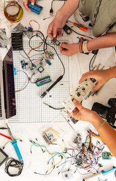 Coworkers making Arduino circuits