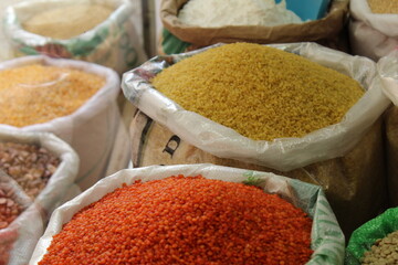 Legumes in big nylon bags in a shop