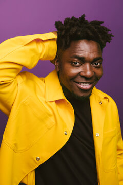 Cheerful black man in trendy outfit