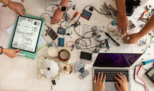Anonymous hands making circuitboards