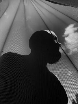 Black and white silhouette of man with beard