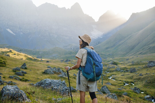 Woman hikes in an alpine mountain area