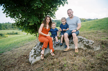 Happy family outdoors together in summer