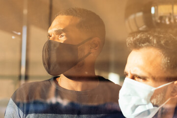 Men with face mask in home during the COVID-19 pandemic