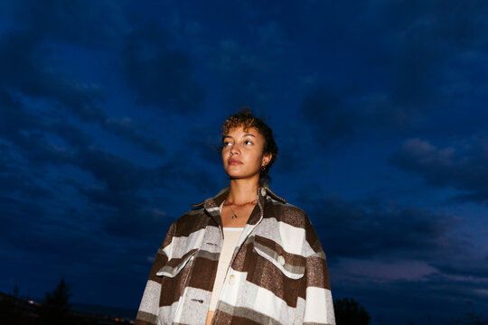 Woman lit by flash at night