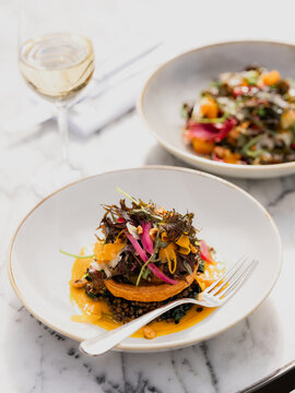 A puff pastry tart lunch with a glass of wine on a sun terrace. 