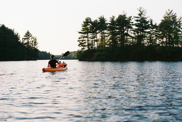 Man and son in a kayak on lake