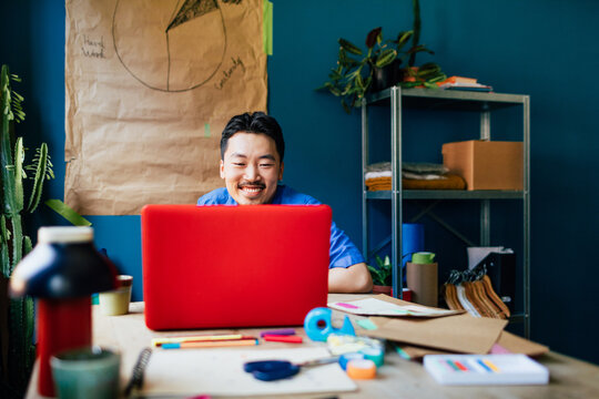 Asian Man Working in Office